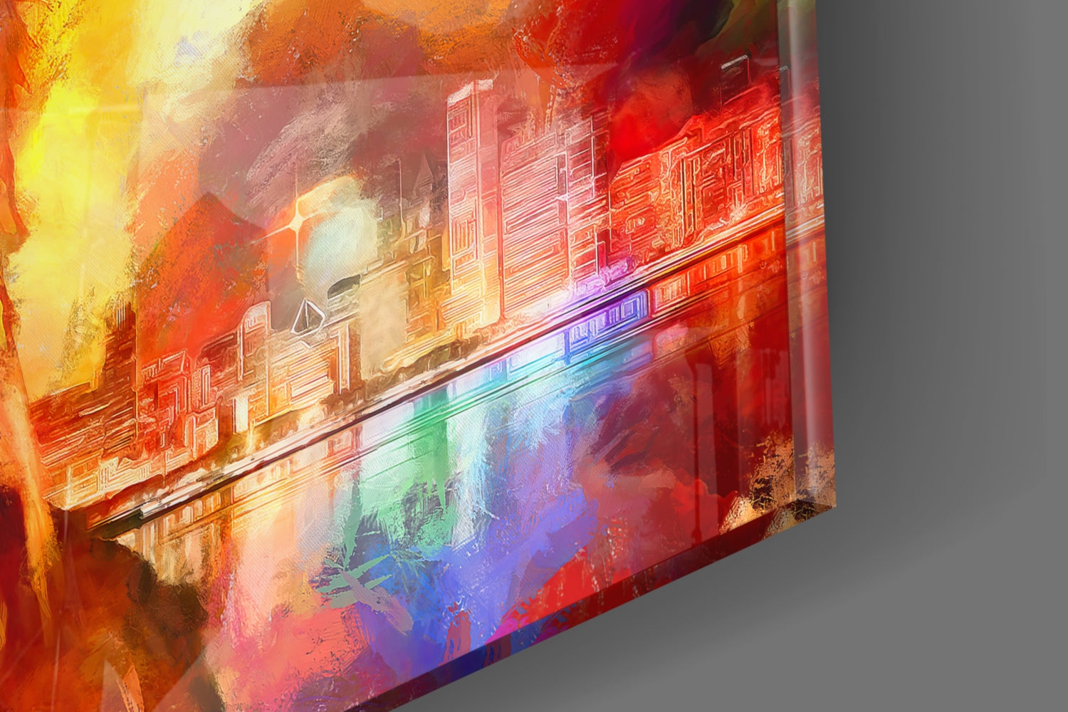 Angled view of glass wall art featuring vibrant red, orange, yellow, blue, and purple gradient overlays on an architectural cityscape design.