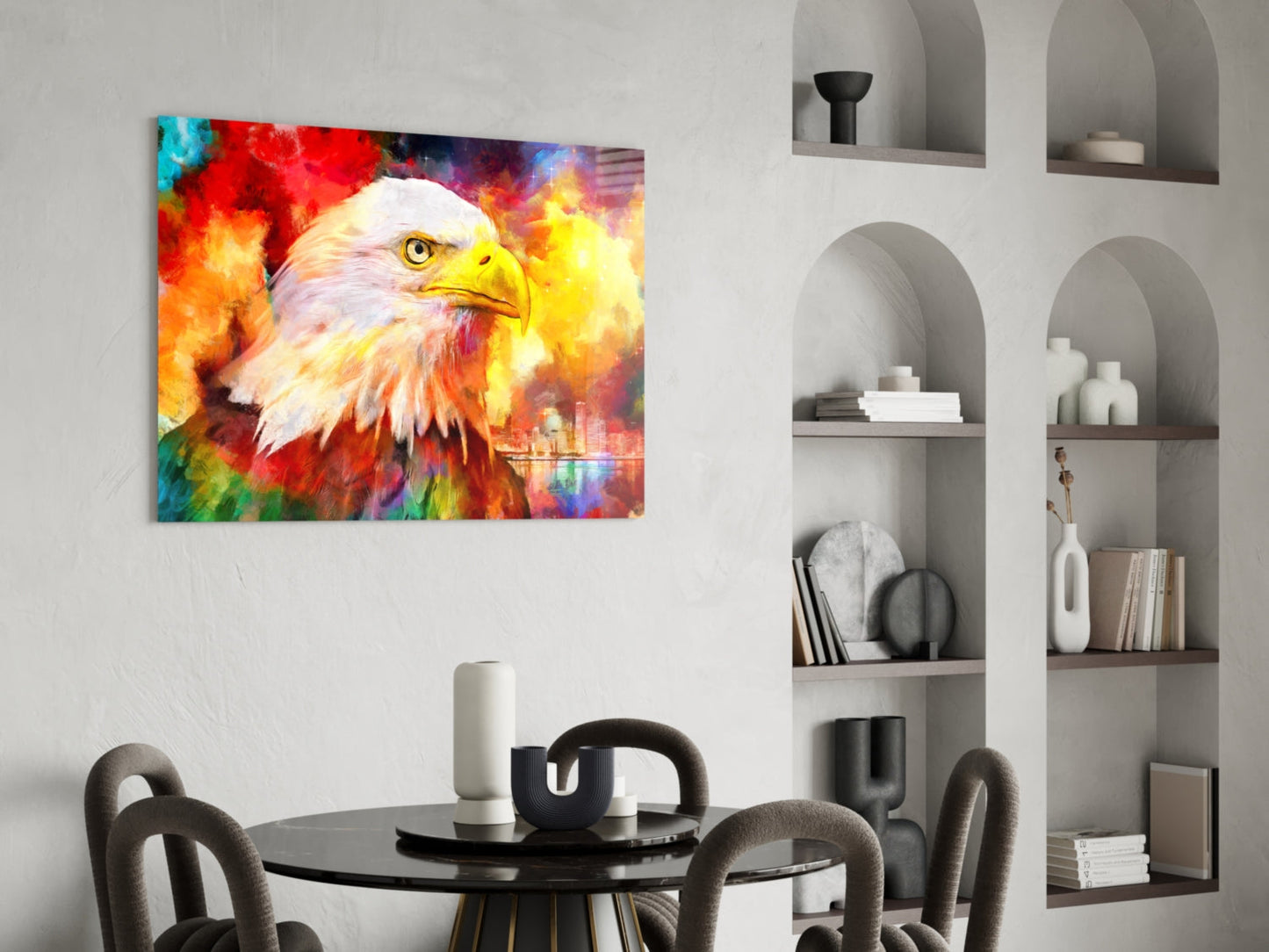 Vibrant glass wall art of an eagle with colorful rainbow background displayed above a round dining table in modern interior setting.