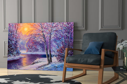 Colorful glass wall art depicting a snowy winter landscape with purple trees and golden sunset, displayed in a modern living room beside a wooden chair.