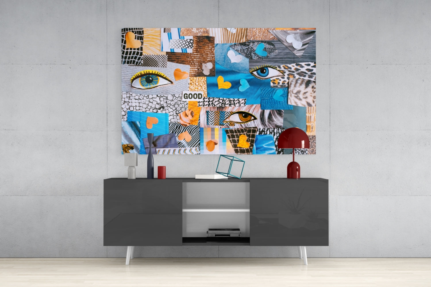 Colorful abstract glass wall art with geometric patterns, eyes, hearts, and "GOOD" text displayed above a dark gray media console.