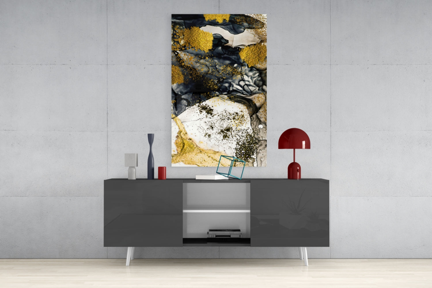 Abstract glass wall art featuring gold, black, and white textures displayed above modern gray media console in contemporary interior setting.
