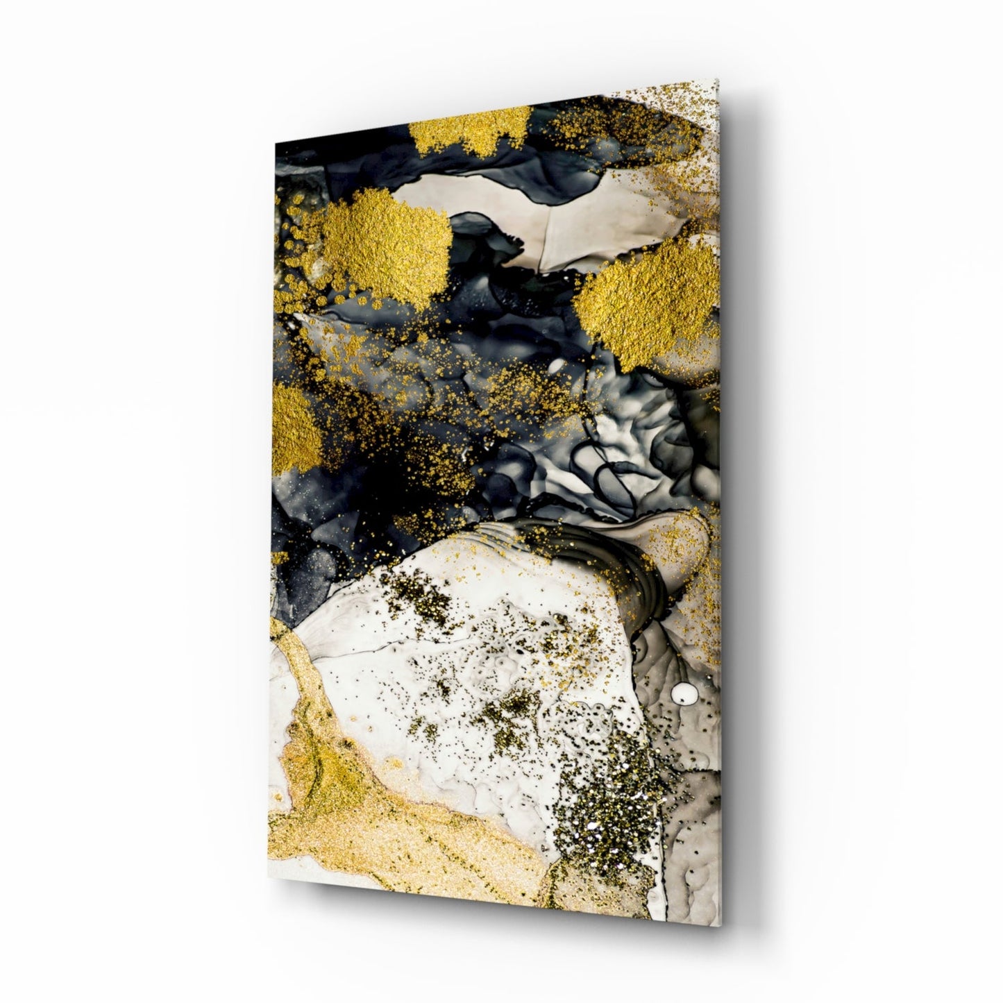 Angled perspective of glass wall art featuring golden and black liquid ink effects with white and gray marble textures on rectangular canvas.