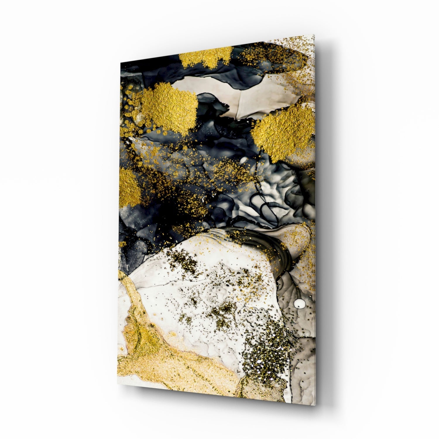 Angled perspective of glass wall art featuring golden and black liquid ink effects with white and gray marble textures on rectangular canvas.