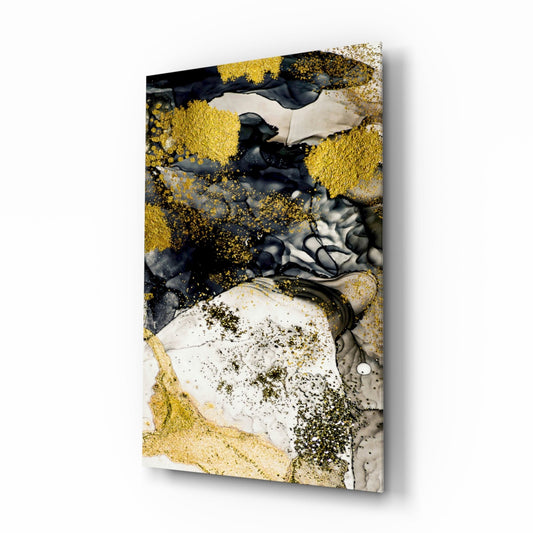 Angled perspective of glass wall art featuring golden and black liquid ink effects with white and gray marble textures on rectangular canvas.