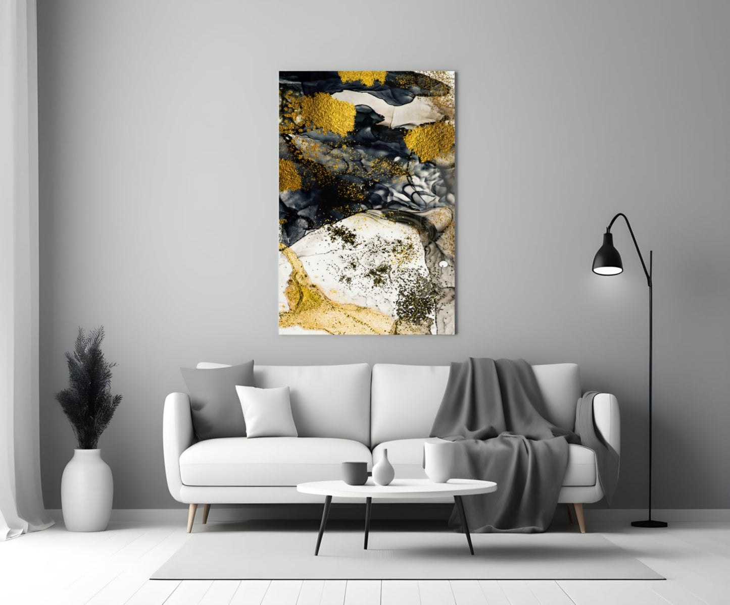 Yellow and white glass wall art with lichen-inspired design displayed above a white sofa in modern living room.