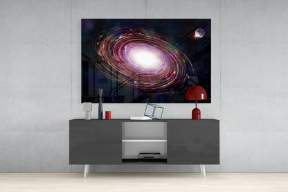 Milky Way Glass Wall Art displaying a spiral galaxy with purple and gold tones mounted above a gray media console in a modern interior.