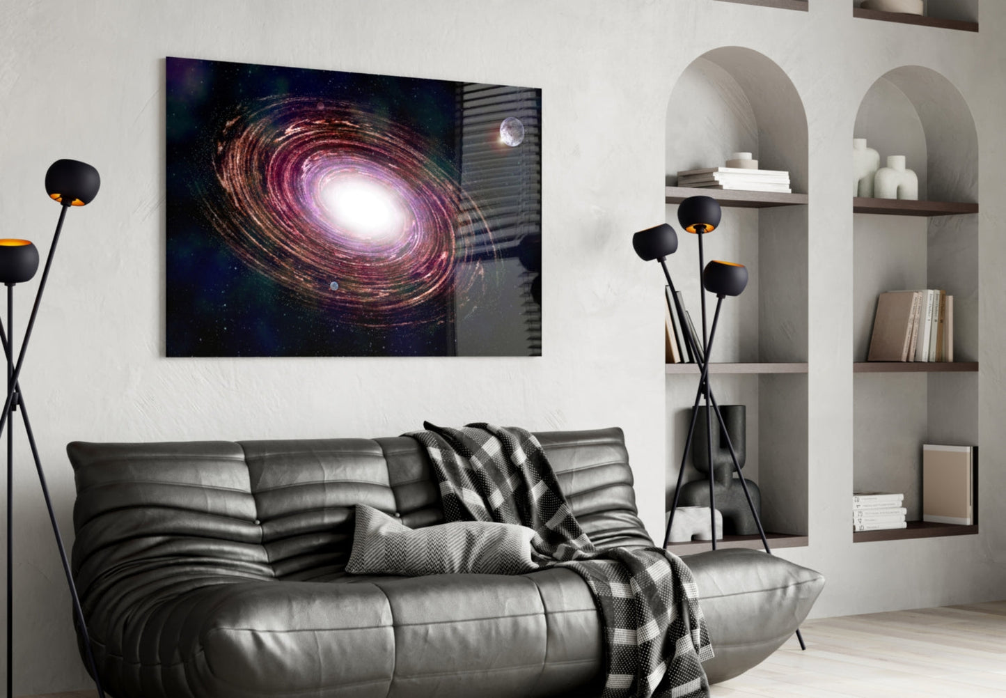 Milky Way Glass Wall Art featuring a spiral galaxy with purple and gold tones displayed above a gray leather sofa in a modern living room interior.