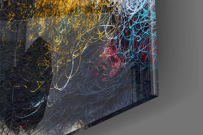 Three-dimensional angled view of glass wall art with layered abstract line patterns in yellow, cyan, red, and white on dark background.