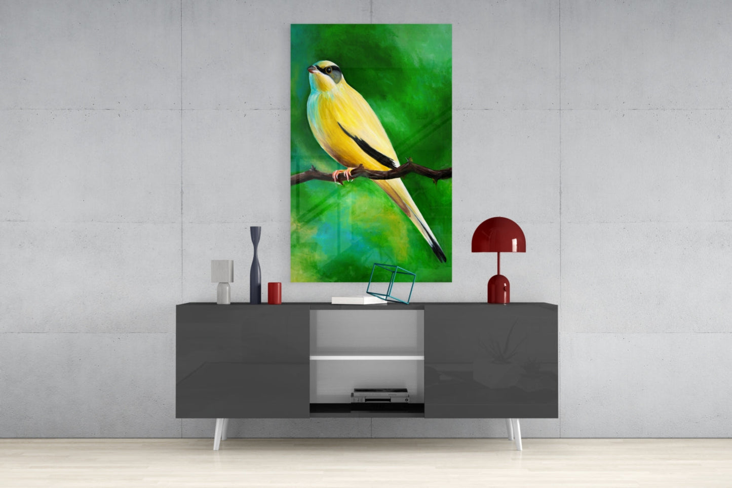Yellow and black bird glass wall art displayed above gray media console in modern interior setting.