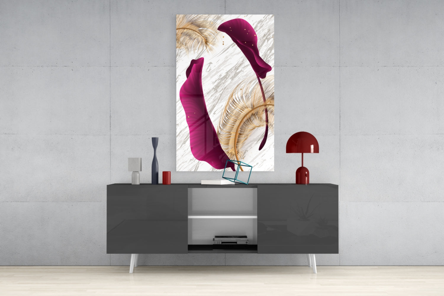 Burgundy leaves glass wall art displayed above a dark gray media console with decorative accessories in a modern interior setting.