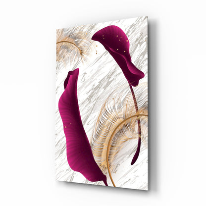 Modern glass wall art featuring two burgundy curved leaf shapes with gold botanical line drawings on a white textured background, displayed at an angle.