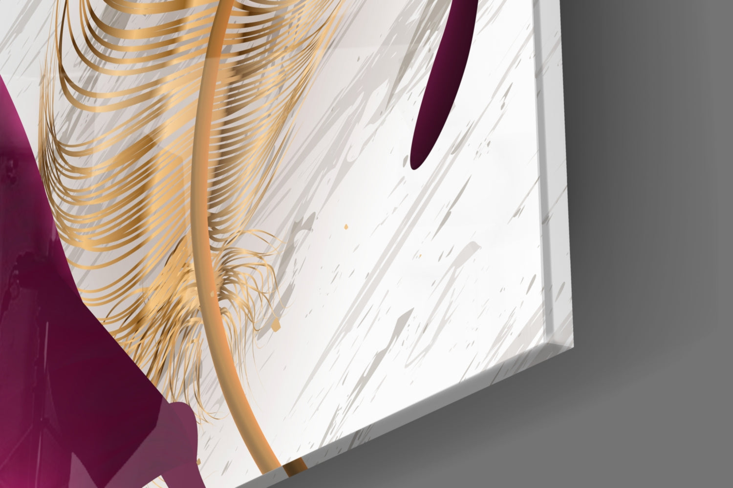 Close-up angled view of burgundy glass wall art with gold leaf design casting shadows on white textured surface.