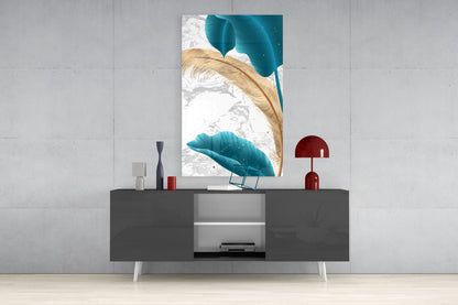 Turquoise and gold leaf glass wall art displayed above a gray media console in a modern interior setting.