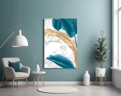Turquoise leaves glass wall art displayed in a serene room setting with teal walls, white furniture, and potted plants.
