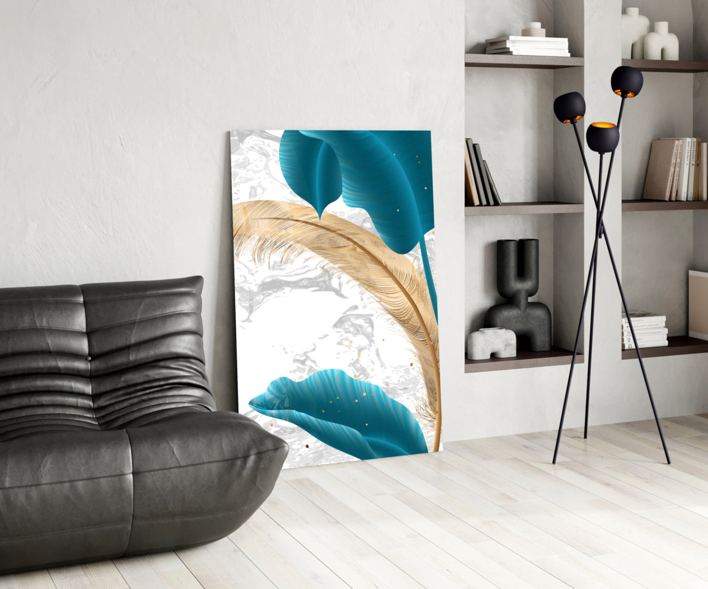 Turquoise leaves glass wall art displayed in a modern living room with black sofa, floor lamp, and white shelving unit.