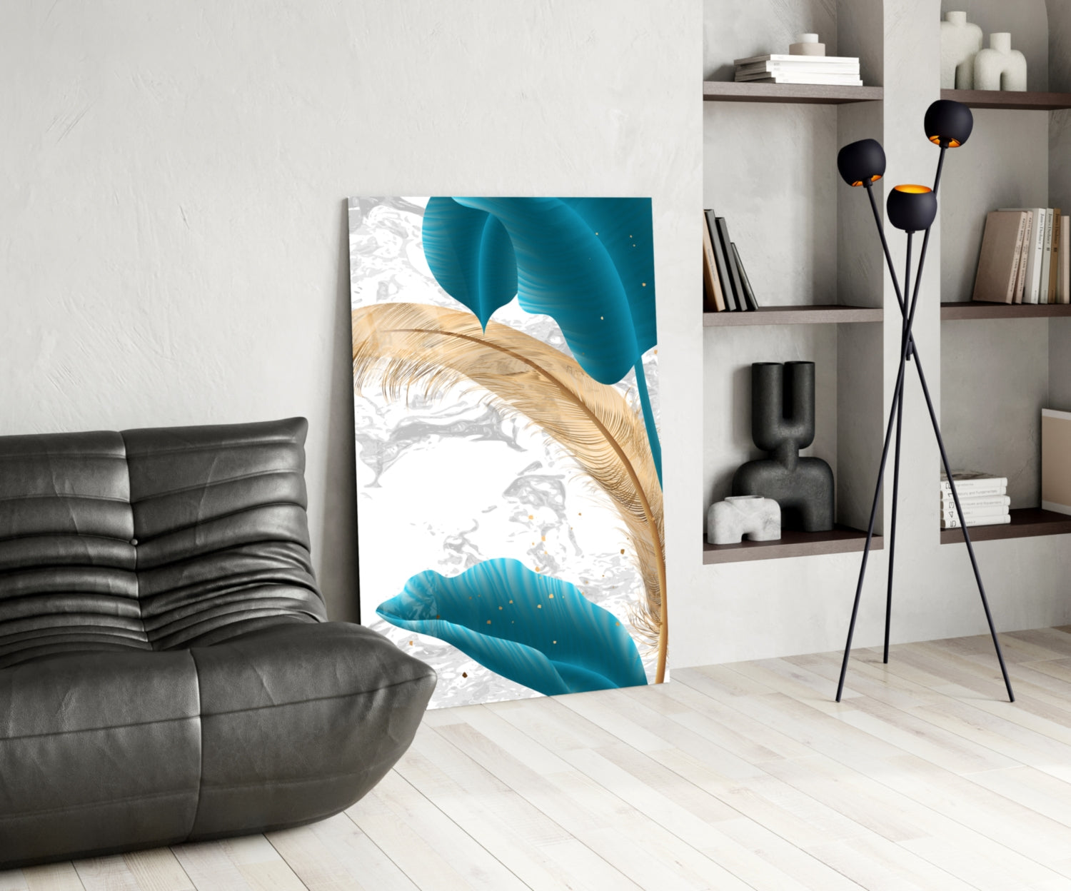 Turquoise leaves glass wall art displayed in a modern living room with black sofa, floor lamp, and white shelving unit.