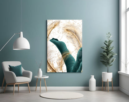 Green Leaves Glass Wall Art displayed in a teal room above a white chair, showing golden and teal leaf designs on white background.