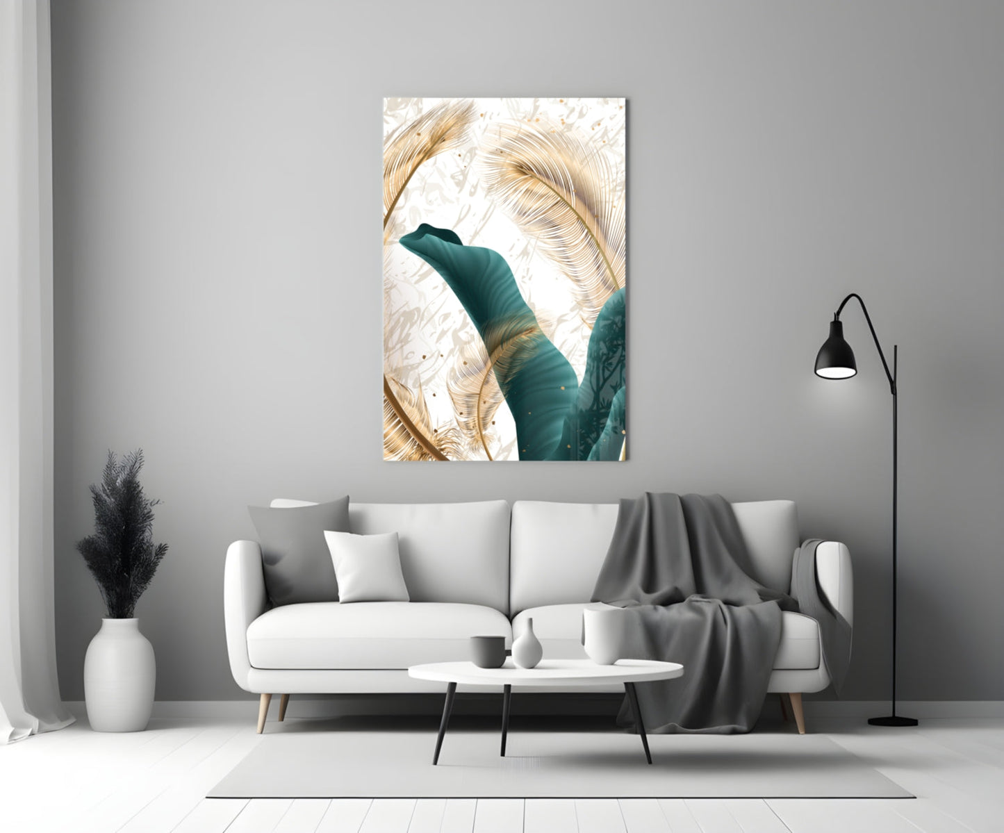Glass wall art featuring green foliage with golden leaves against white background, displayed above living room sofa.