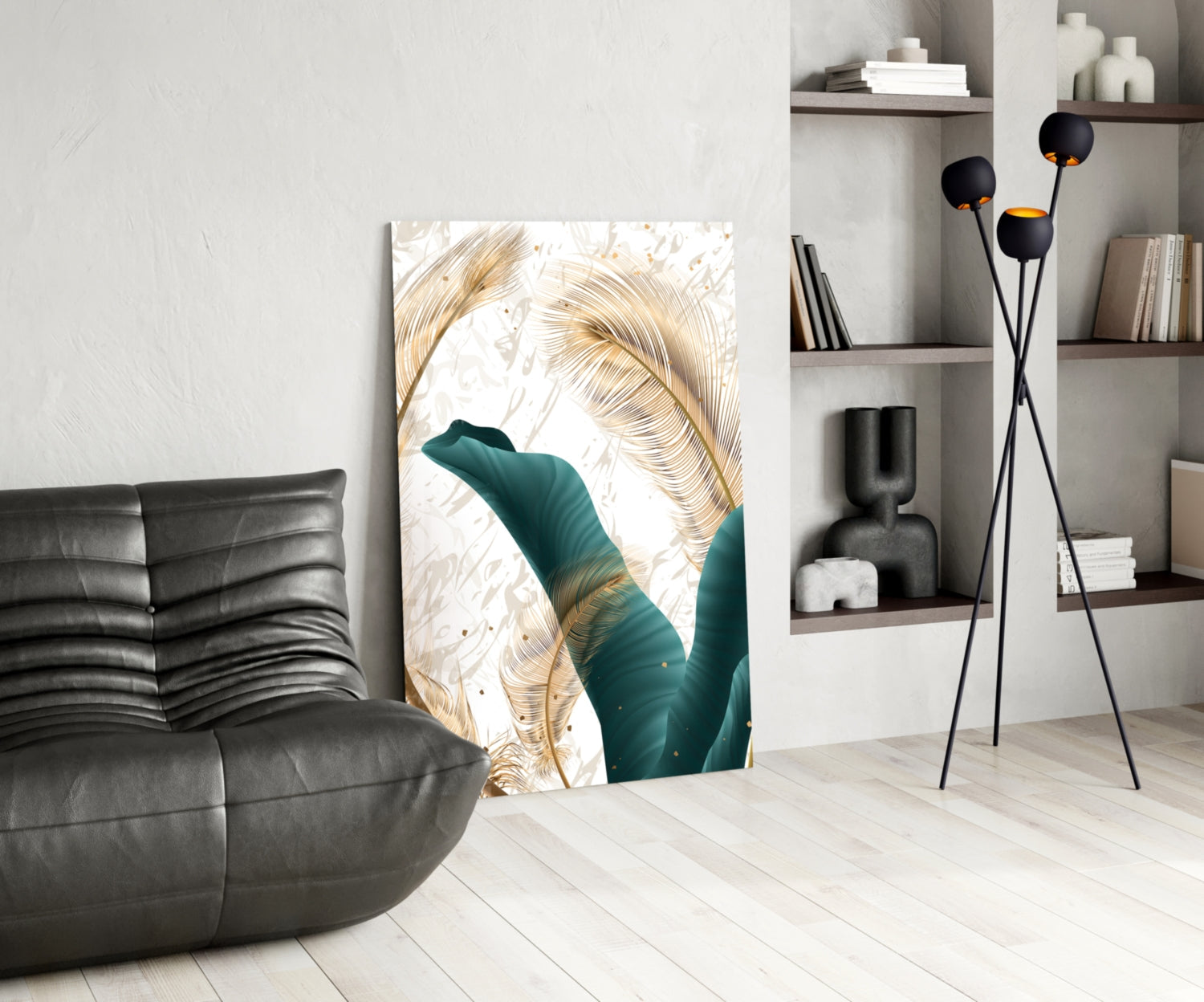 Modern living room interior featuring green and gold glass wall art with tropical leaf design beside black leather sofa.