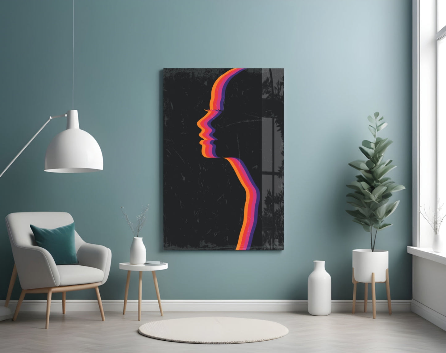 Colorful neon-style face profile artwork on black glass panel displayed on teal wall in minimalist room setting.