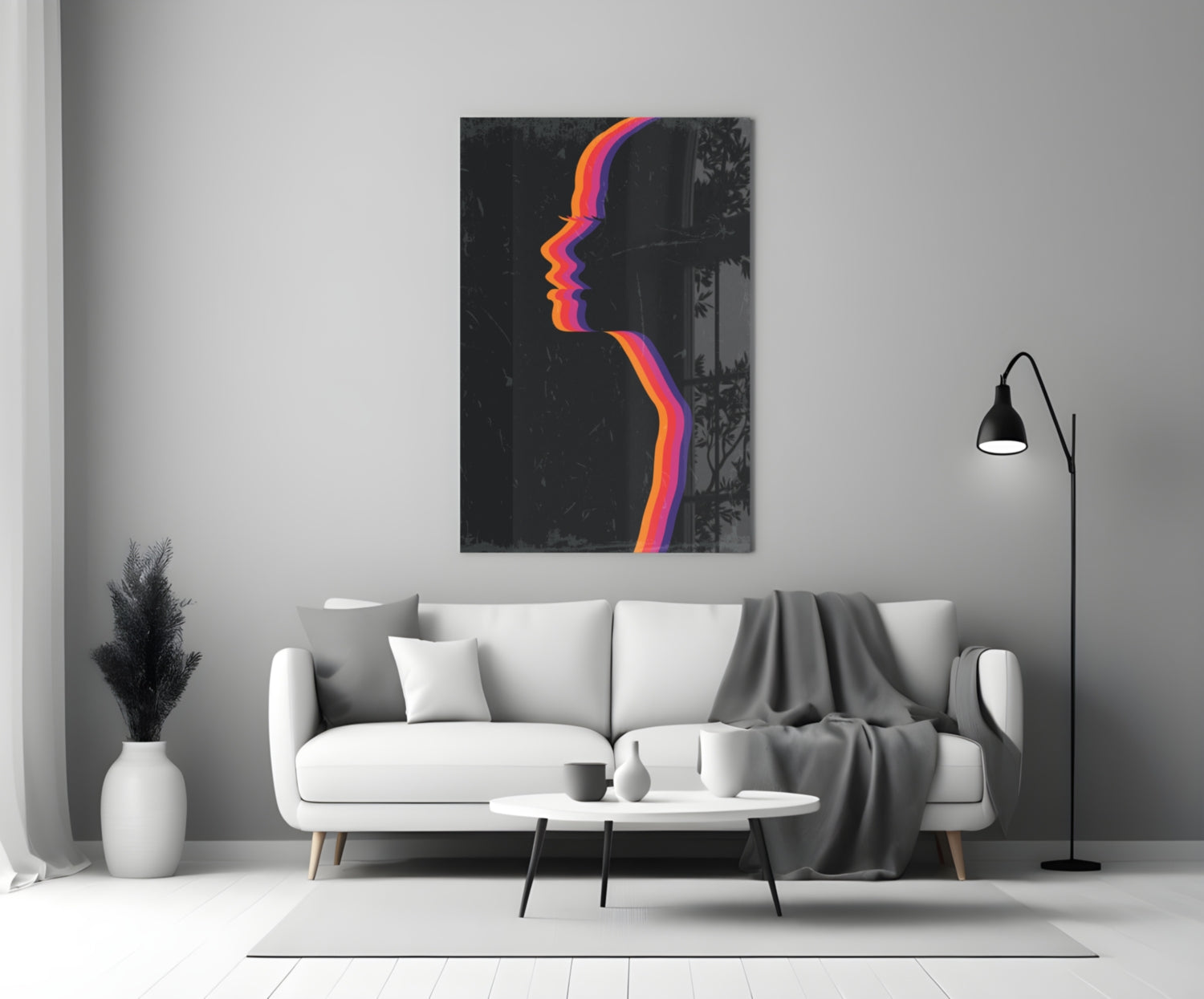 Modern living room with white sofa displaying colorful neon profile silhouette glass wall art above.