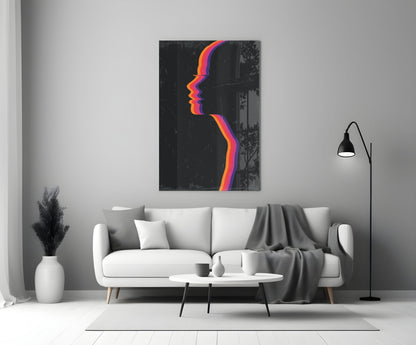 Modern living room with white sofa displaying colorful neon profile silhouette glass wall art above.