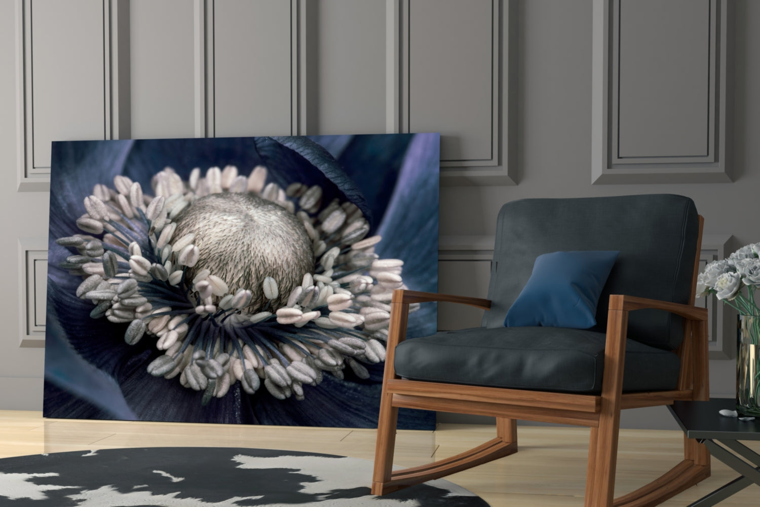 Gray flower glass wall art displaying a white and gray gerbera daisy on dark blue background, displayed in modern living room setting.