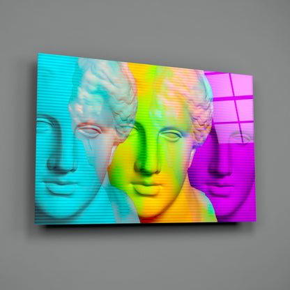 Three classical stone busts displayed on a glass panel with vibrant cyan, yellow, lime green, and magenta color blocking and horizontal scan lines.