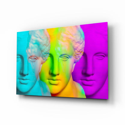 Three classical busts in cyan, lime-yellow, and magenta with horizontal scan lines on glass wall art, angled perspective view.