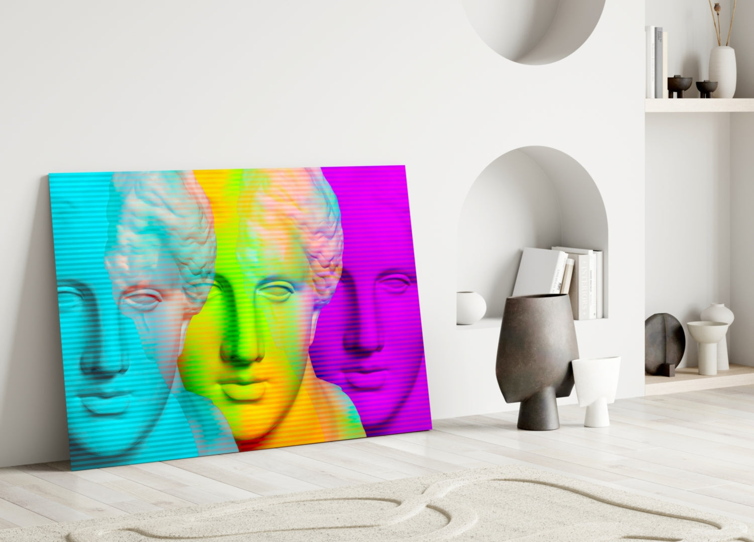 Vibrant pop art glass wall panel featuring three classical busts in cyan, lime green, and magenta gradients, leaning against white interior wall with shelving.