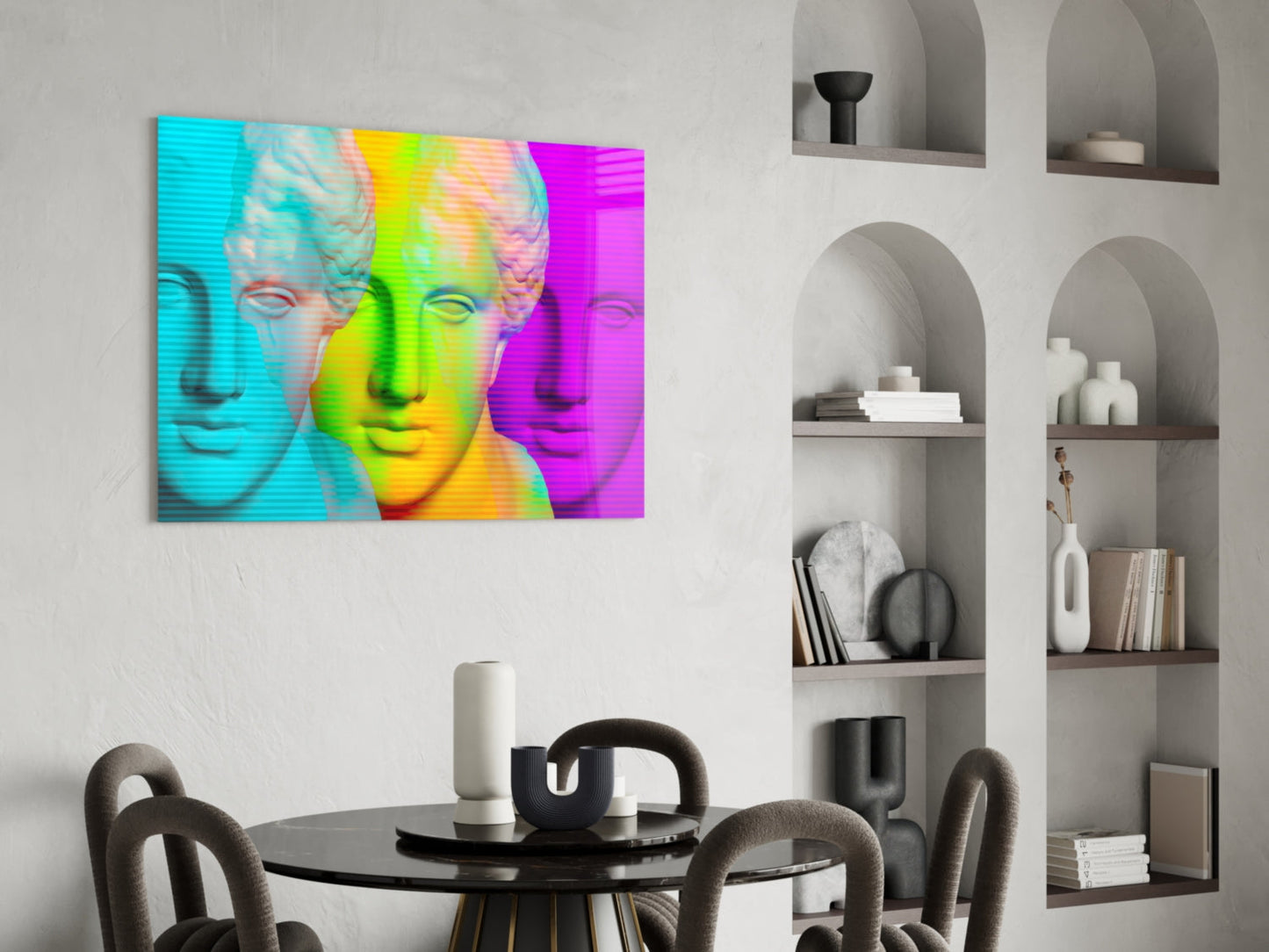 Vibrant pop art glass wall art featuring three colorful classical busts in cyan, yellow, and magenta tones displayed above a modern dining table.