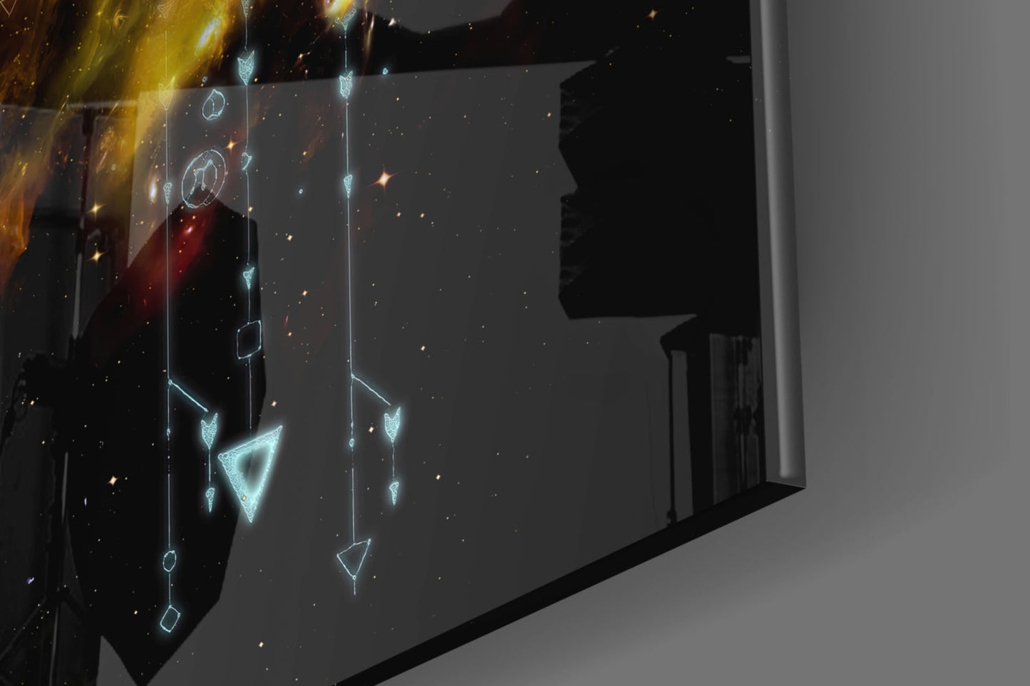 Illuminated glass wall art displaying glowing cyan geometric shapes and symbols suspended against a dark starry background, installed in modern interior space.