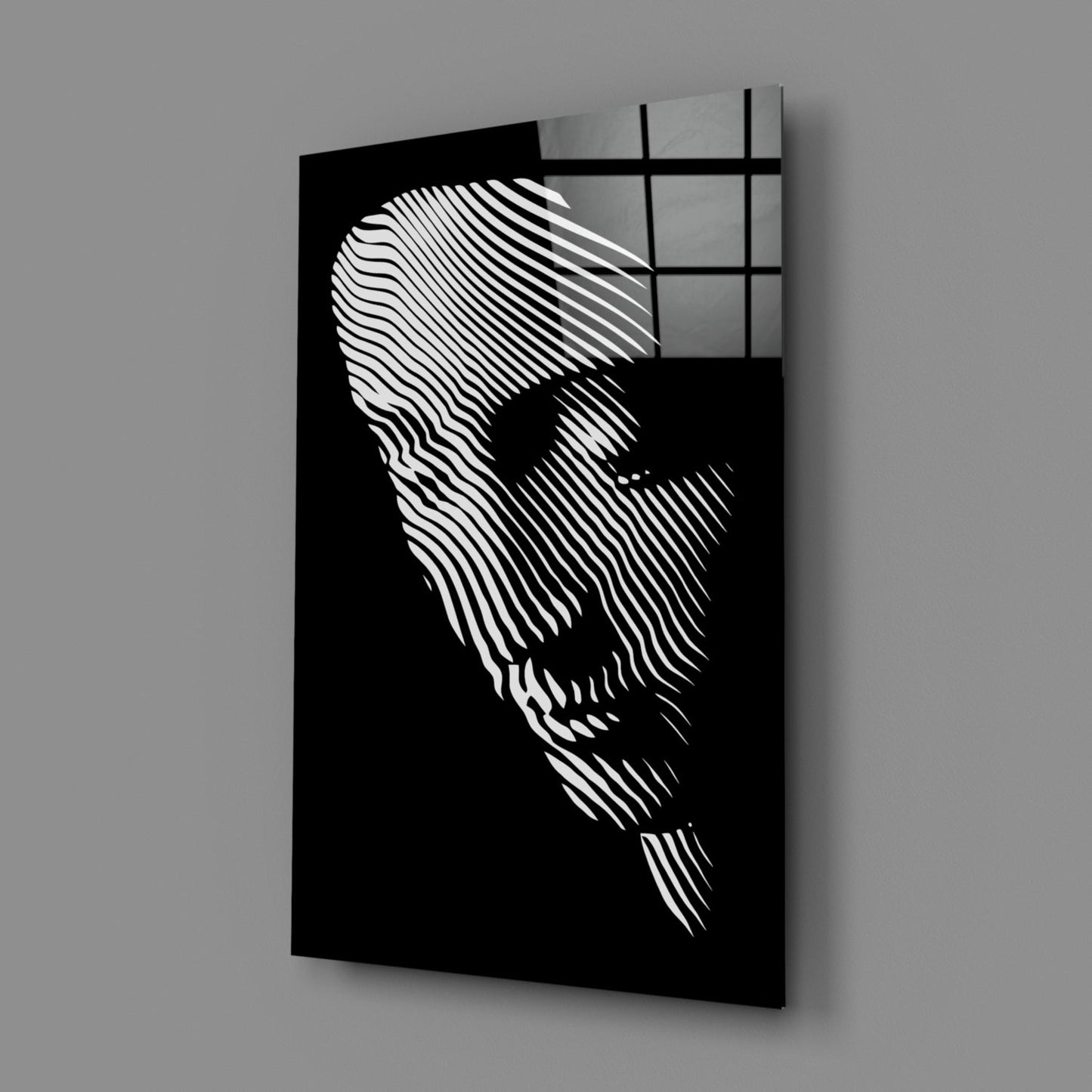 Black glass wall art panel featuring white linear striations forming a contemplative face profile, angled three-quarter view with shadow casting.