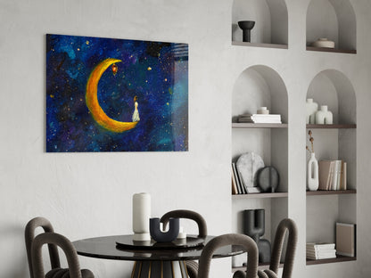 Moon House Glass Wall Art depicting a glowing golden crescent moon with a figure in starry blue night sky, displayed above a dining table.