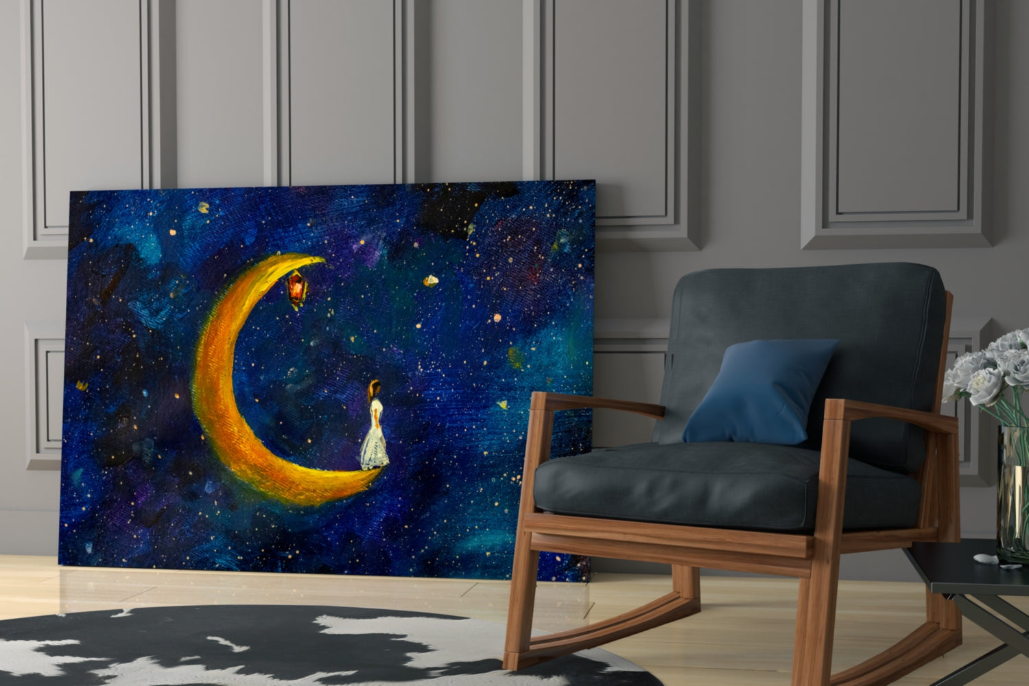 Glass wall art depicting a figure in white dress standing beneath a glowing golden crescent moon against a deep blue starry night sky, displayed in a modern living room setting.