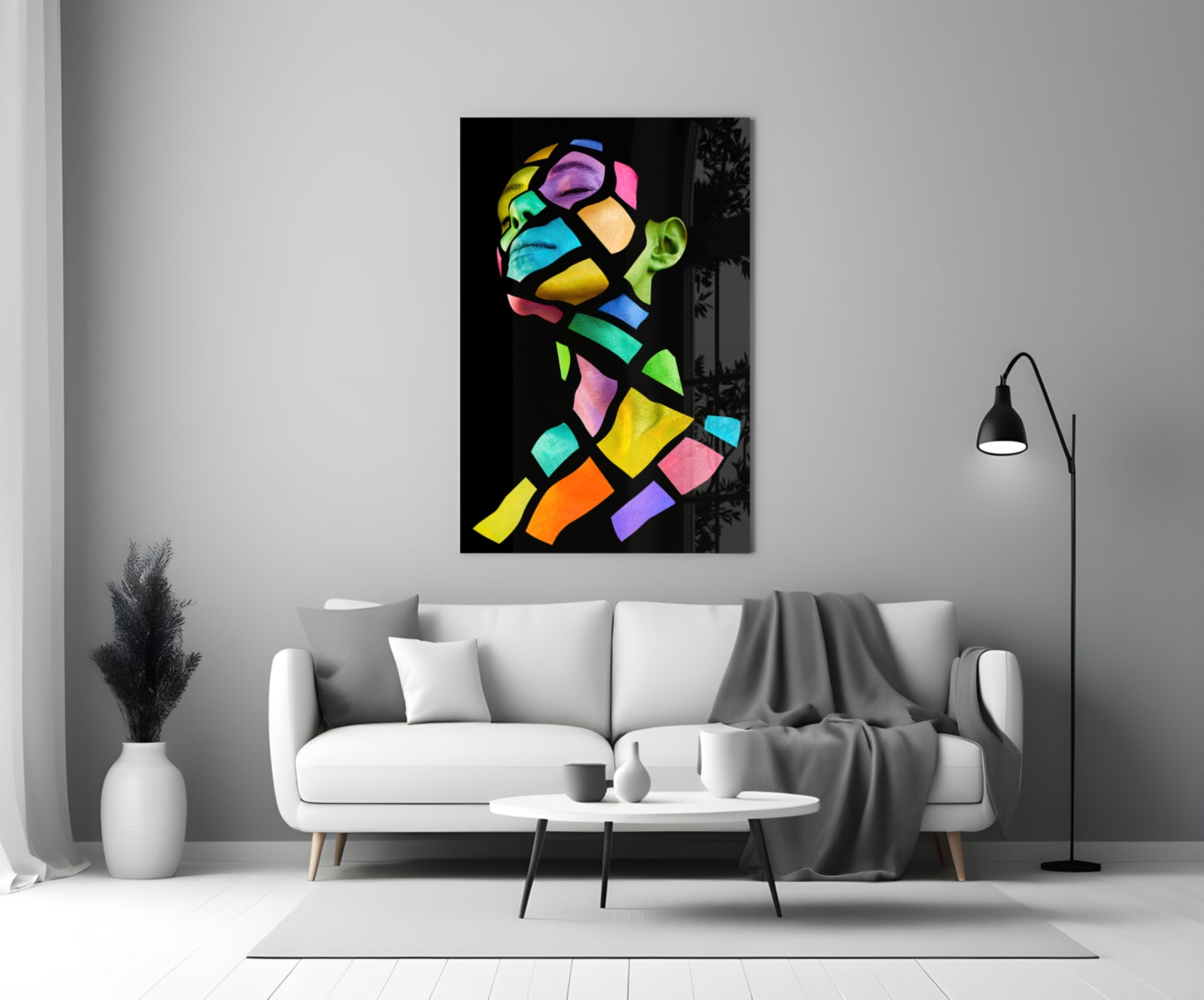 Colorful Spirit Glass Wall Art displayed above white sofa in minimalist living room with black floor lamp and white vase.