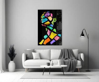 Colorful Spirit Glass Wall Art displayed above white sofa in minimalist living room with black floor lamp and white vase.