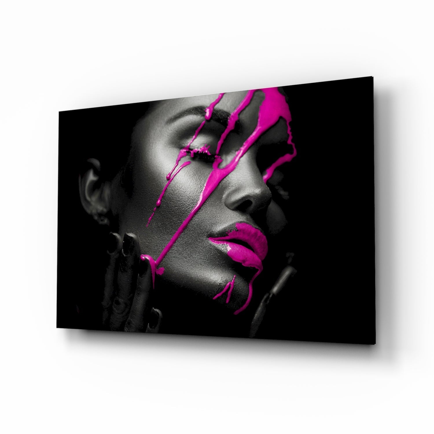 Black and white portrait with bright magenta neon line art overlay on woman's face displayed on glass wall art panel.