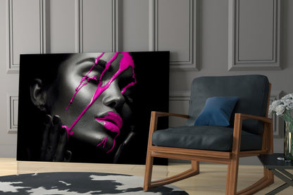 Black and white portrait with bright magenta neon lines displayed on glass in modern living room setting.