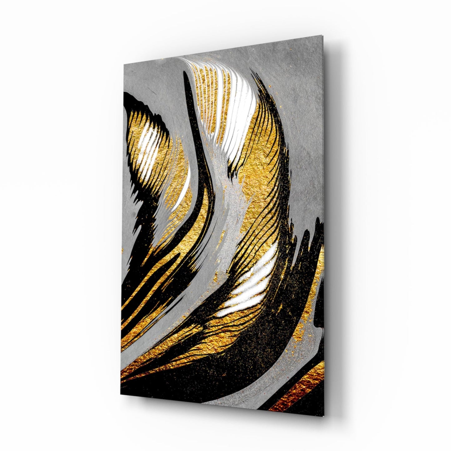 Angled product shot of glass wall art featuring gold and black brushstrokes on gray background with dimensional shadow effect.