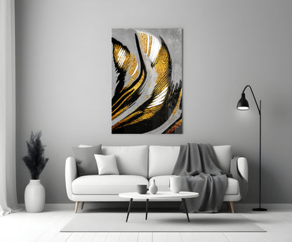 Golden Wings Glass Wall Art featuring black, gold, and white striped abstract design displayed above white sofa in modern living room.