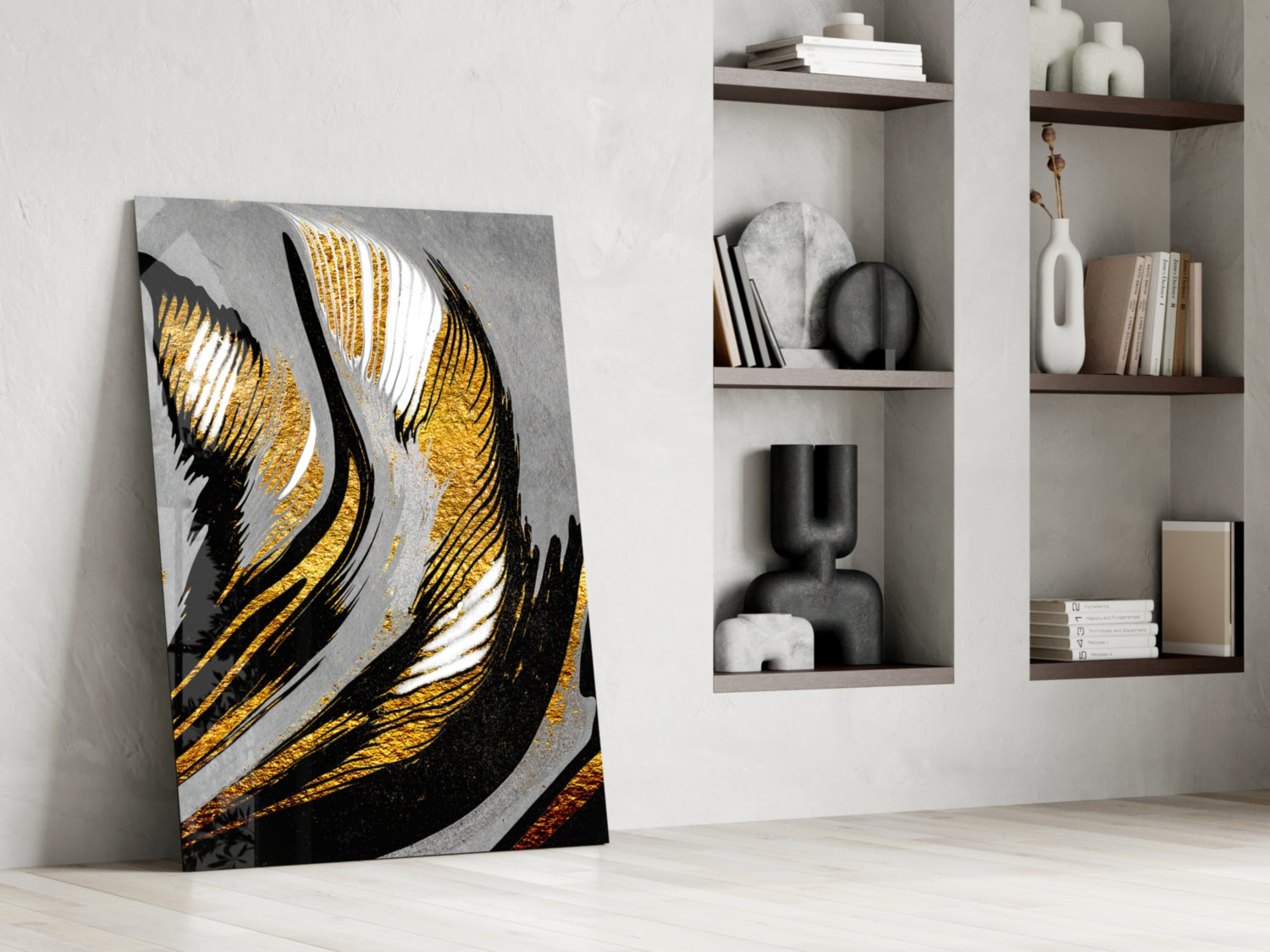 Golden Wings glass wall art leaning against white wall beside built-in shelving with decorative objects and books.