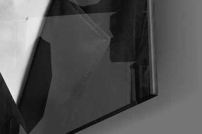 Close-up angle view of layered black and white glass art panels with geometric shapes and varying opacity levels.