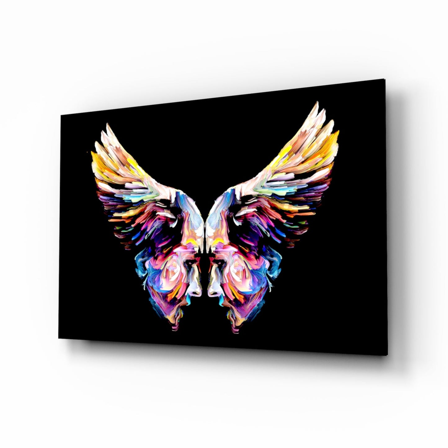 Colorful abstract butterfly glass wall art with vibrant rainbow brushstrokes on black background, displayed at angle.