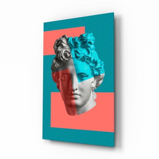Three-dimensional angled view of glass wall art featuring a classical bust split between grayscale, cyan, and coral sections on teal background.