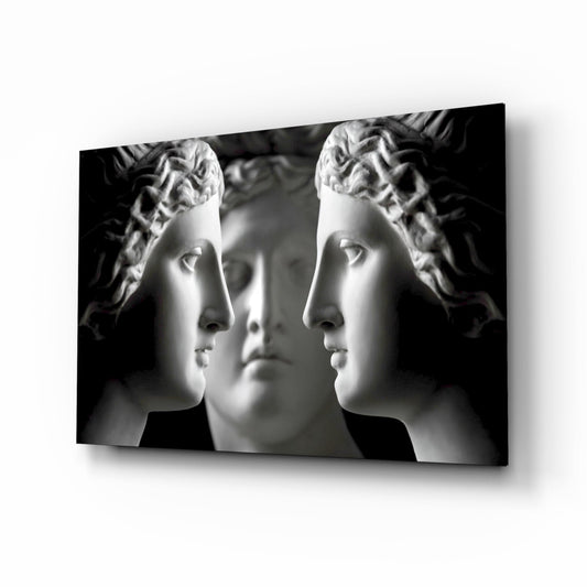 Three white marble classical busts in profile facing left and right against black background, displayed as glass wall art.