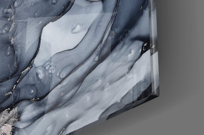 Close-up detail of gray smoke glass wall art showing swirled charcoal and white layered patterns with metallic gold accents.