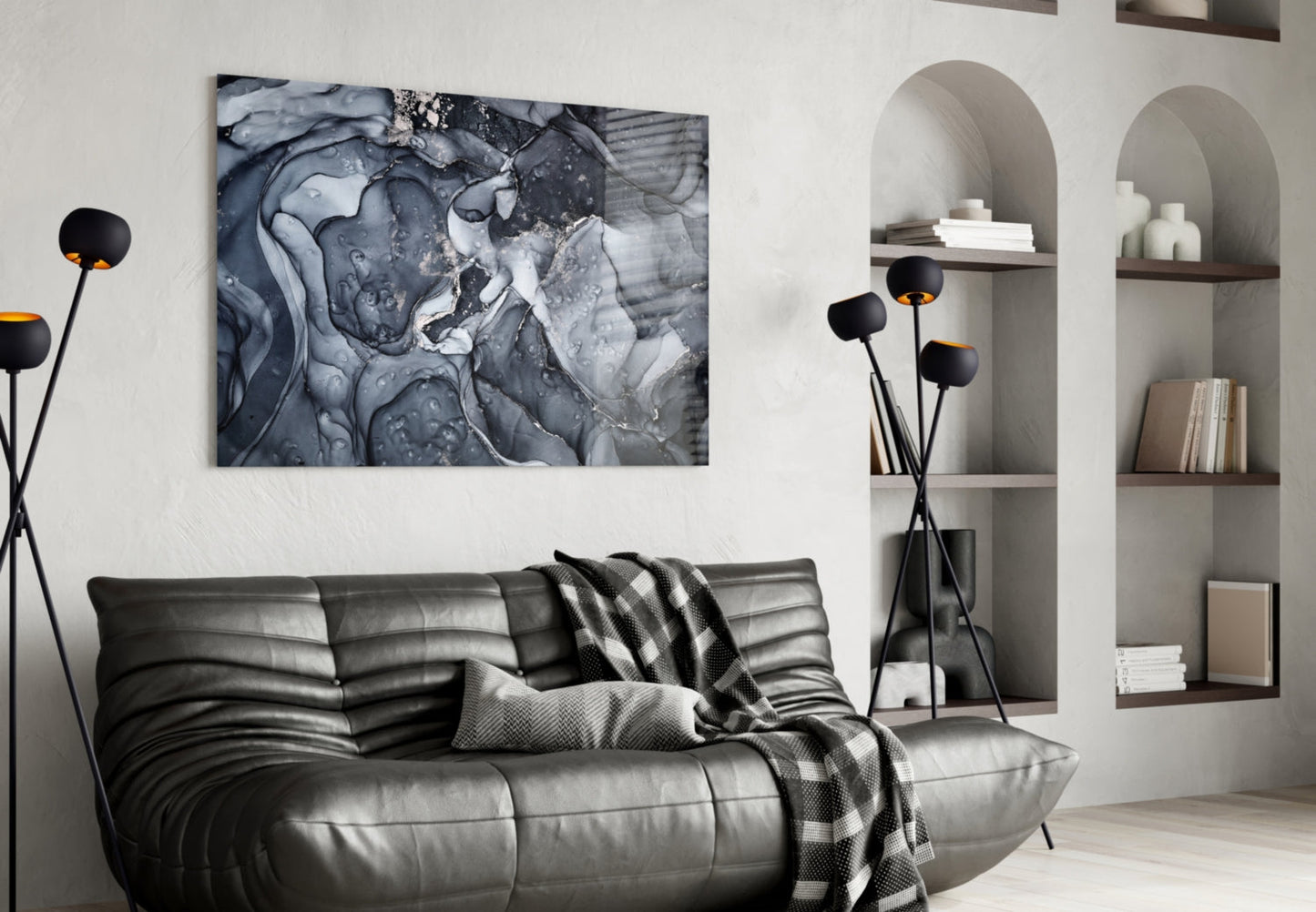 Gray Smoke Glass Wall Art displayed above a black leather sofa in a modern living room with built-in shelving.