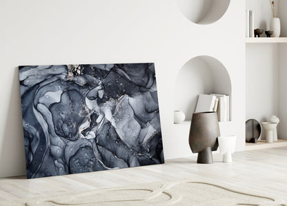 Gray Smoke Glass Wall Art leaning against white wall in minimalist interior with sculptural ceramics and shelving.
