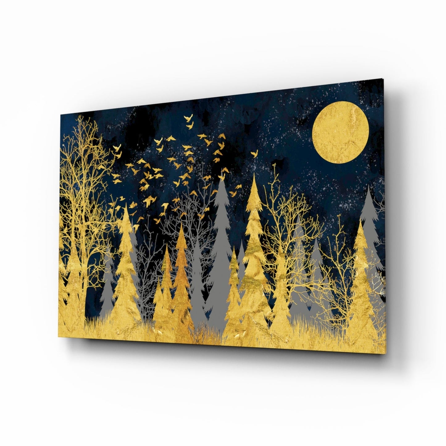 A glass wall art panel displaying a gold forest landscape with trees, flying birds, a full moon, and dark blue night sky background, shown at an angled perspective.